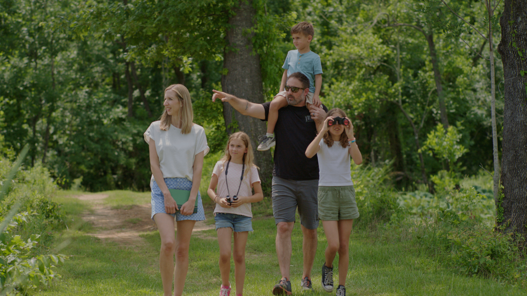 Family enjoying a hike through the forest